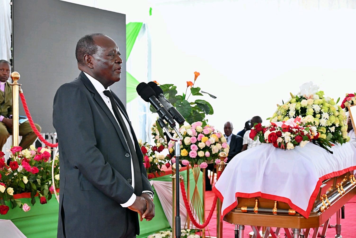 Vihiga County Governor Dr. Wilber Ottichilo addresses mourners during Amb. Mbaya's funeral