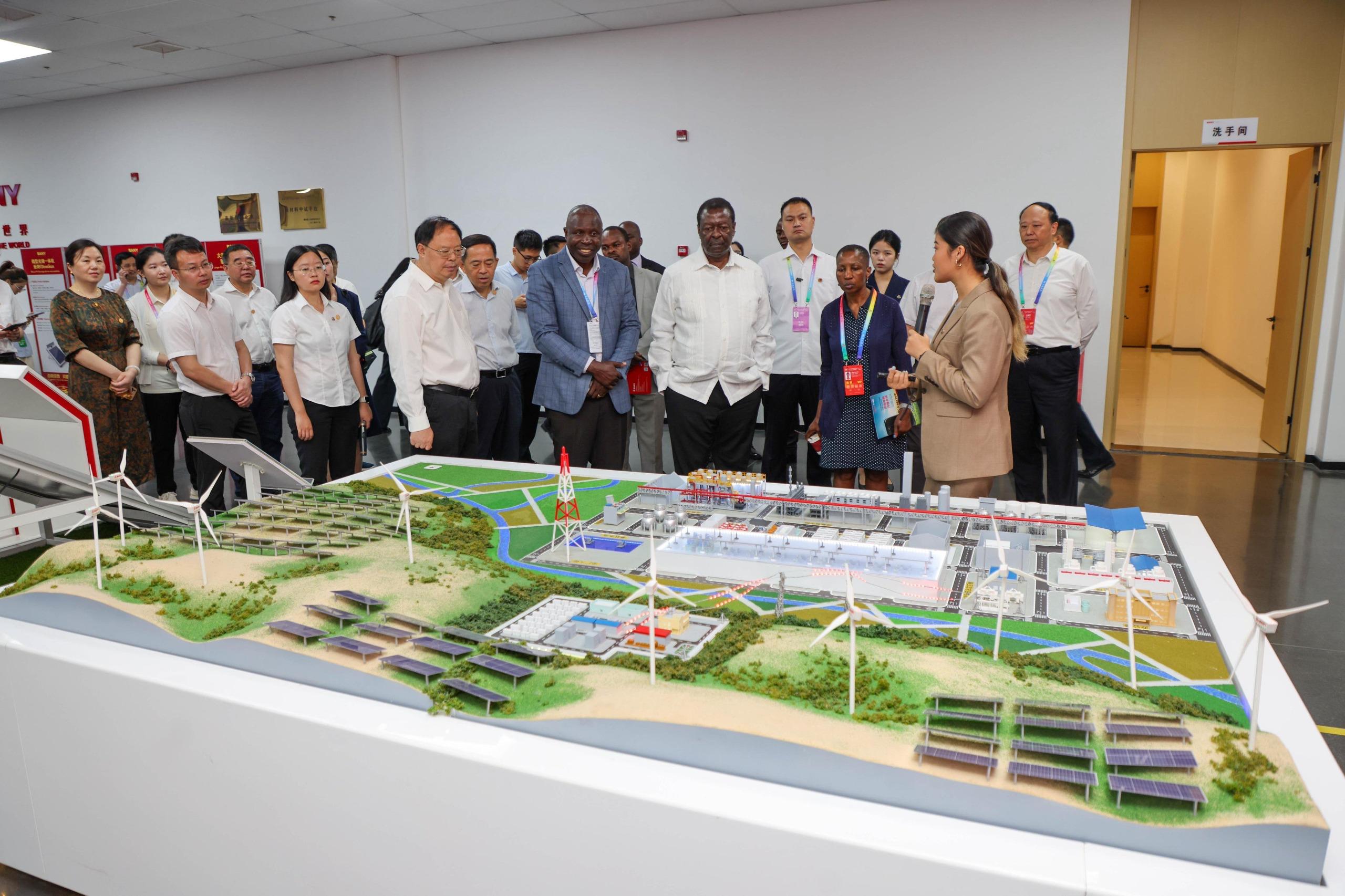 PCS Mudavadi on a tour with with executives from SANY Silicon Energy