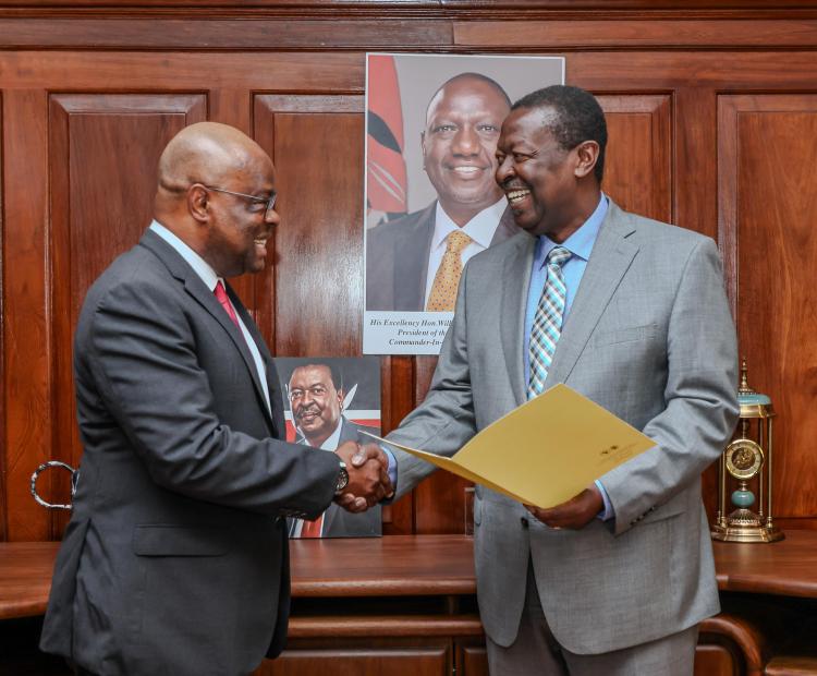 Dr. Musalia Mudavadi, receives letters of appointment from the Incoming Director General for Eastern Africa Regional Office and Country Manager for Kenya for the African Development Bank, Mr. Kennedy K. Mbekeani.