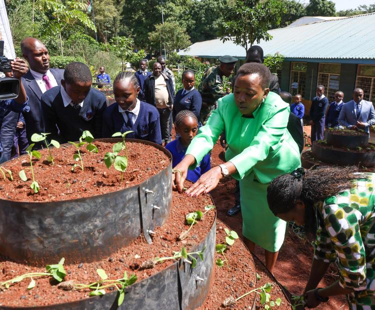 First Lady planting vegetables